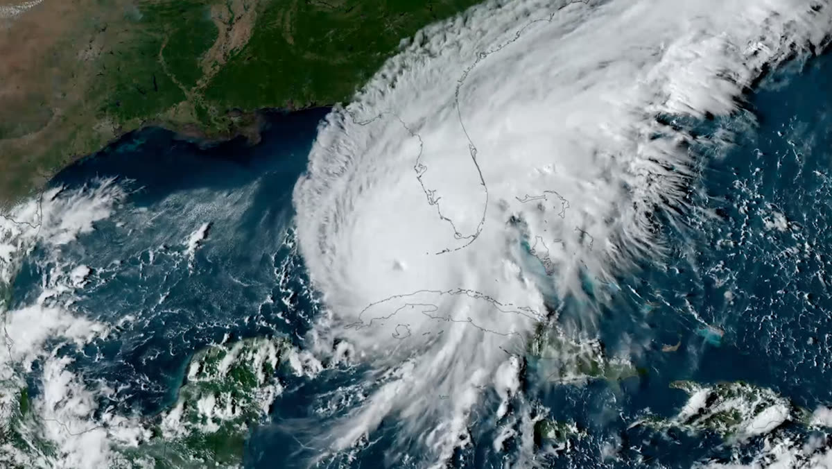 Satellite image of Hurricane Ian approaching the Florida coast at sunset